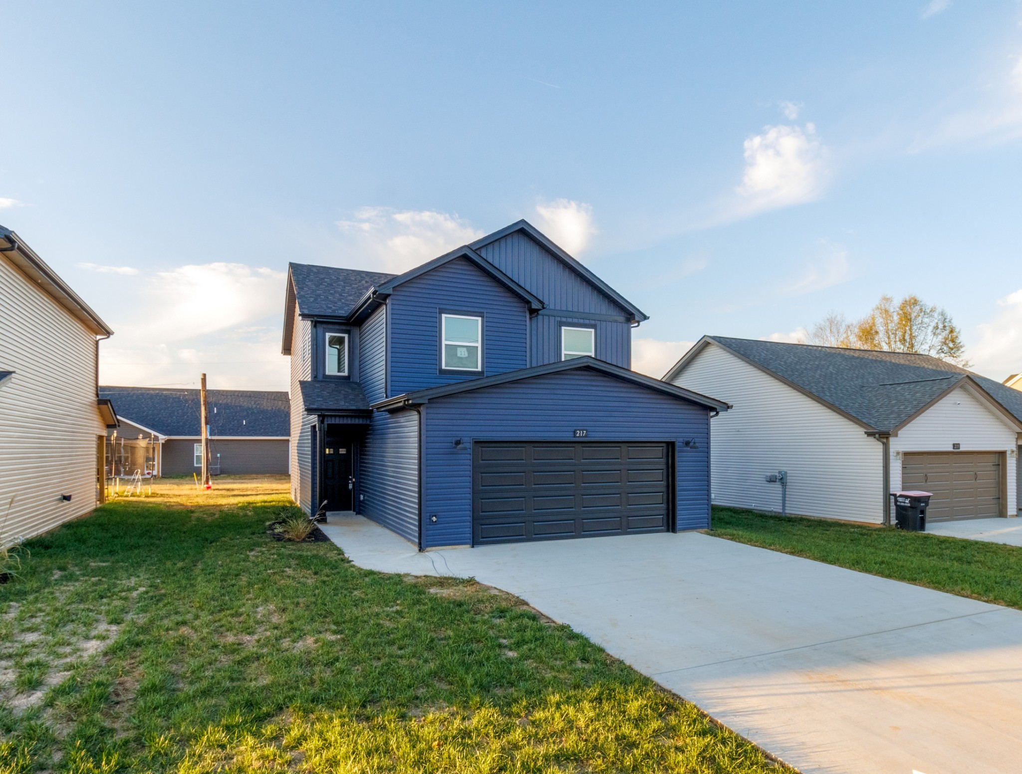 217 Clark Road Clarksville, TN 37042 - Photo 2 of 36 a front view of a house with a yard and garage