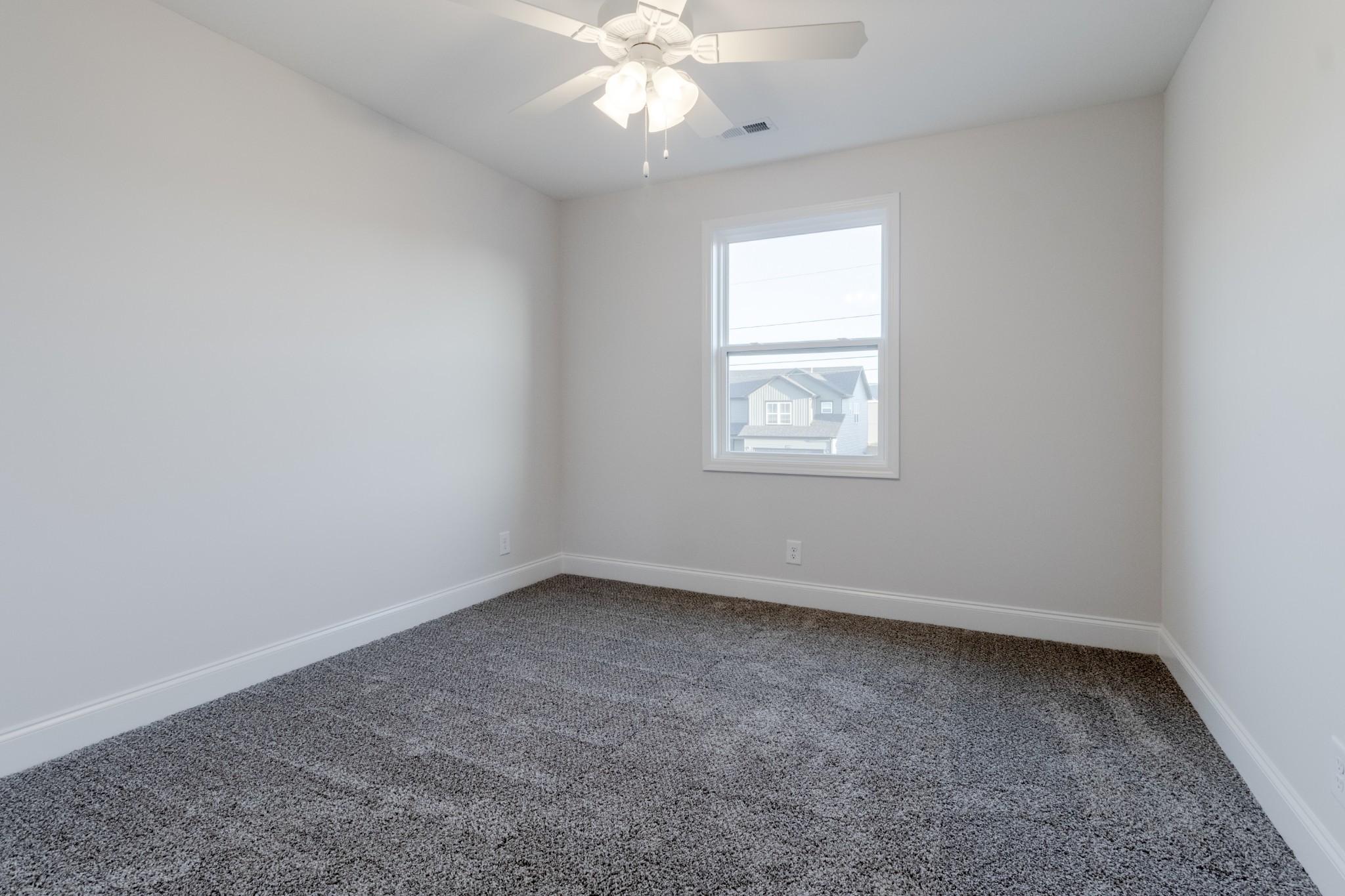 217 Clark Road Clarksville, TN 37042 - Photo 27 of 36 an empty room with a window and a fan