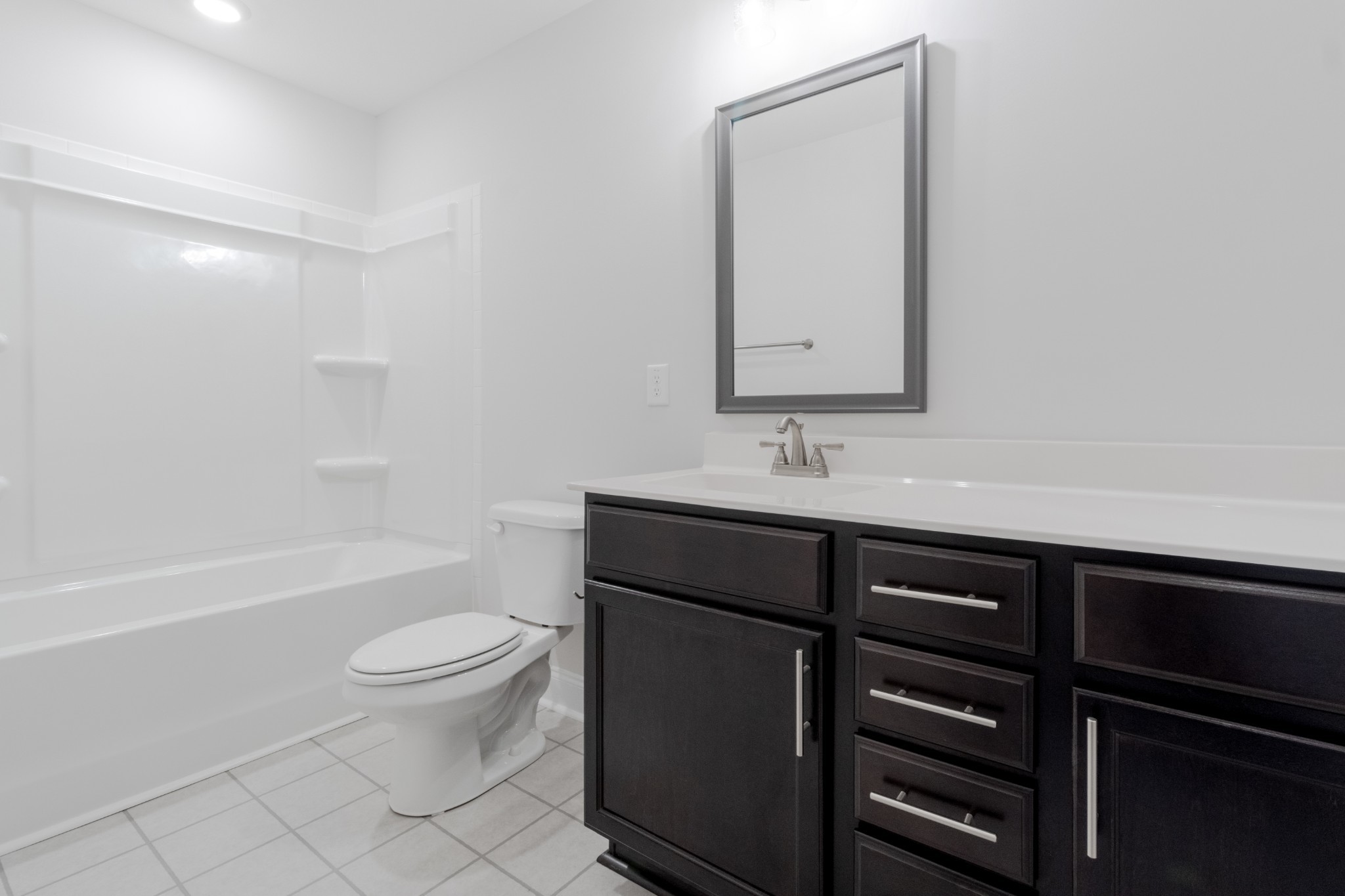 217 Clark Road Clarksville, TN 37042 - Photo 29 of 36 a bathroom with a sink a toilet a mirror and shower