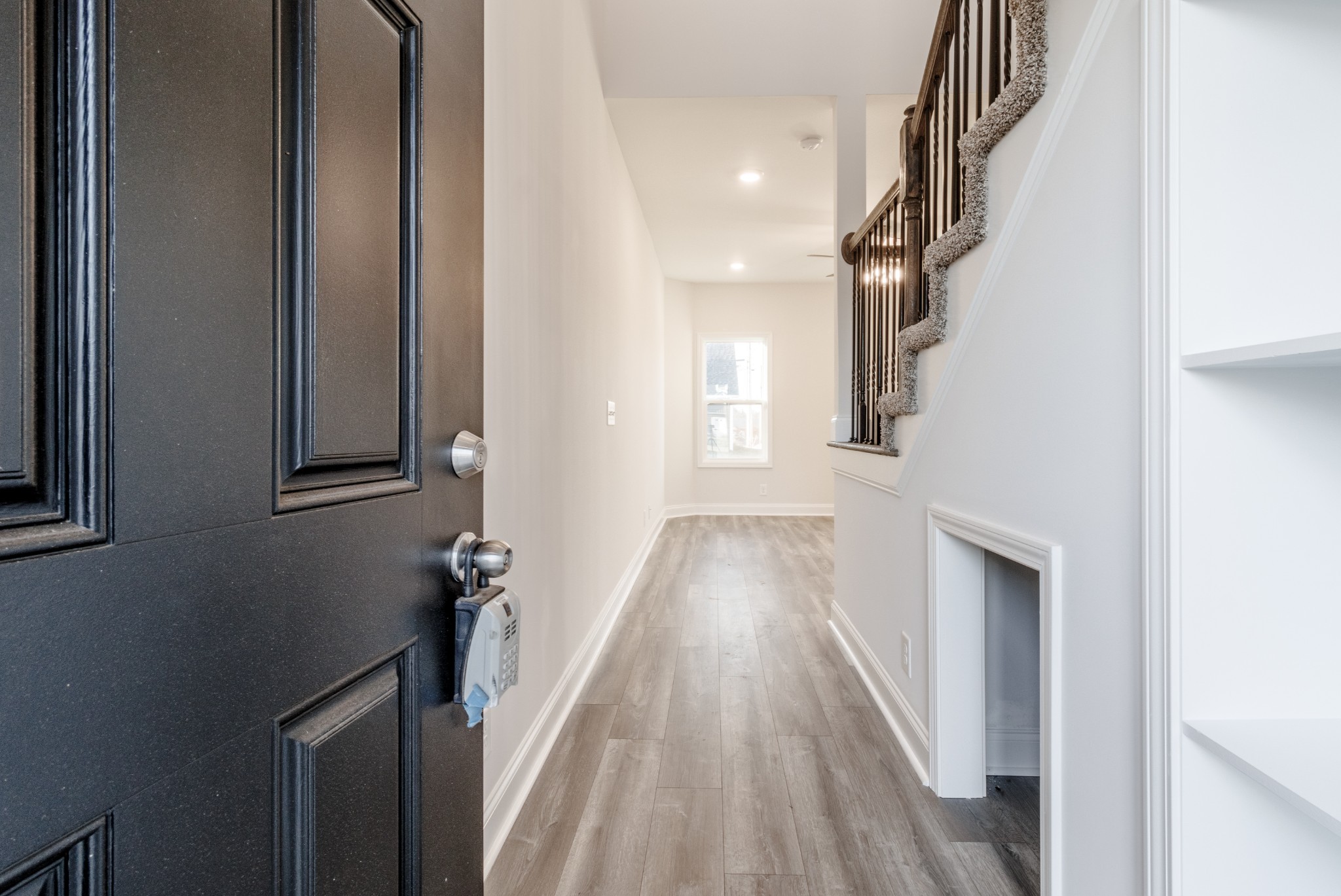 217 Clark Road Clarksville, TN 37042 - Photo 8 of 36 a view of a hallway with wooden floor and staircase