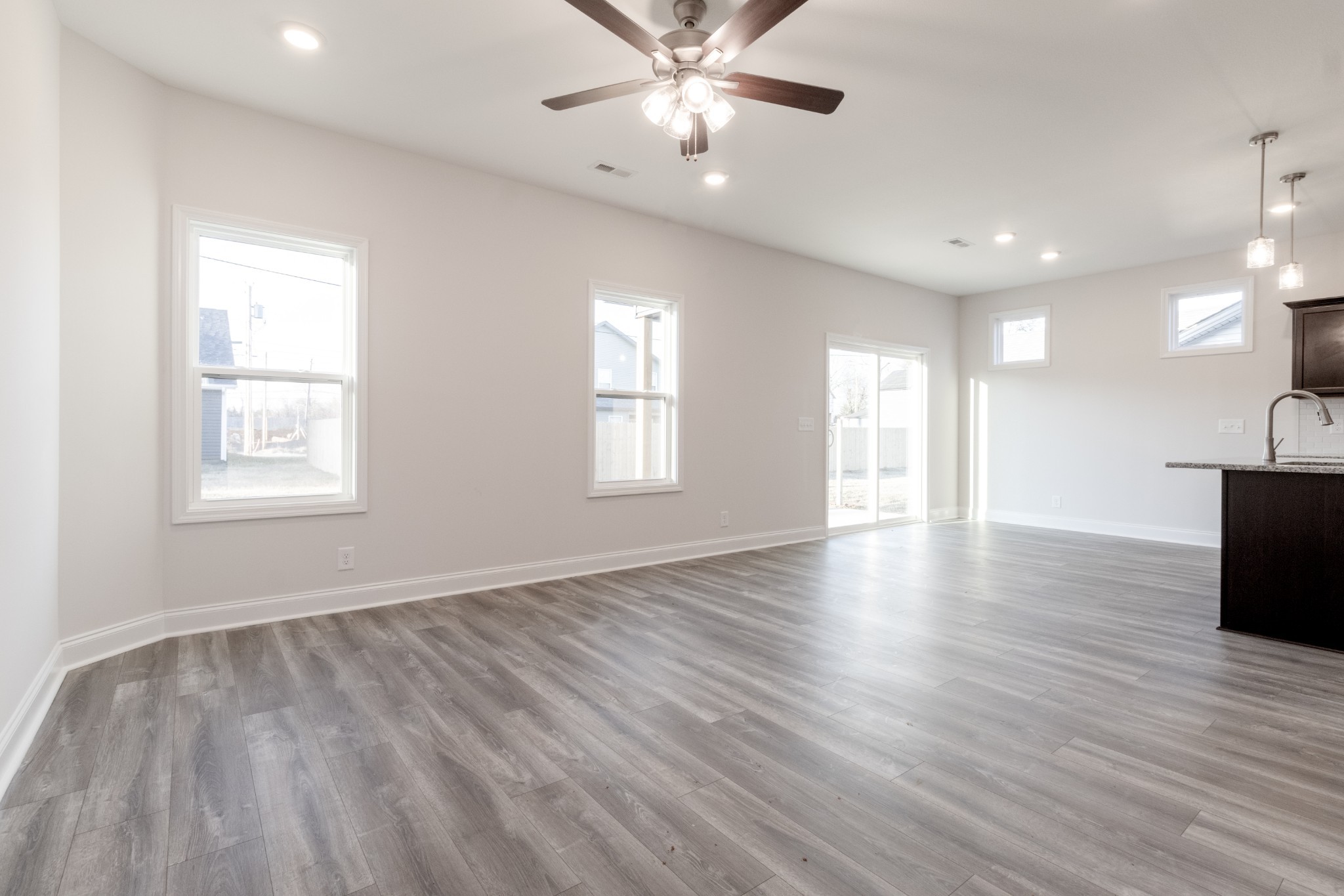 217 Clark Road Clarksville, TN 37042 - Photo 10 of 36 a view of an empty room with window and wooden floor