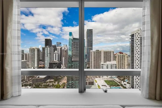 a spacious bedroom with a bed and a couch