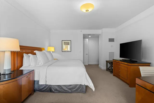 a spacious bathroom with a granite countertop sink a mirror and a shower
