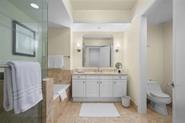 a view of hallway with mirror and window