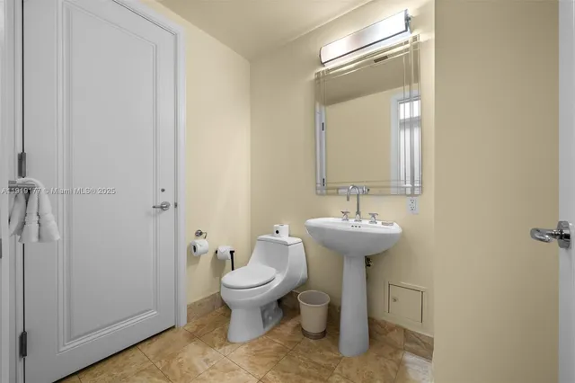 a bedroom with a bed and a lamp on table