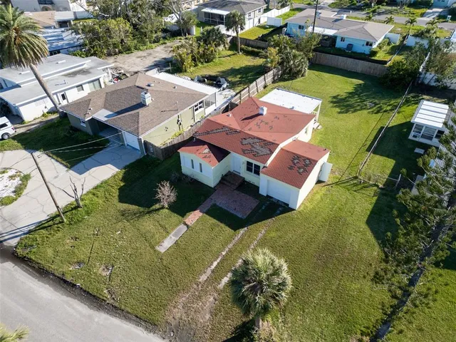 an aerial view of a house with a swimming pool