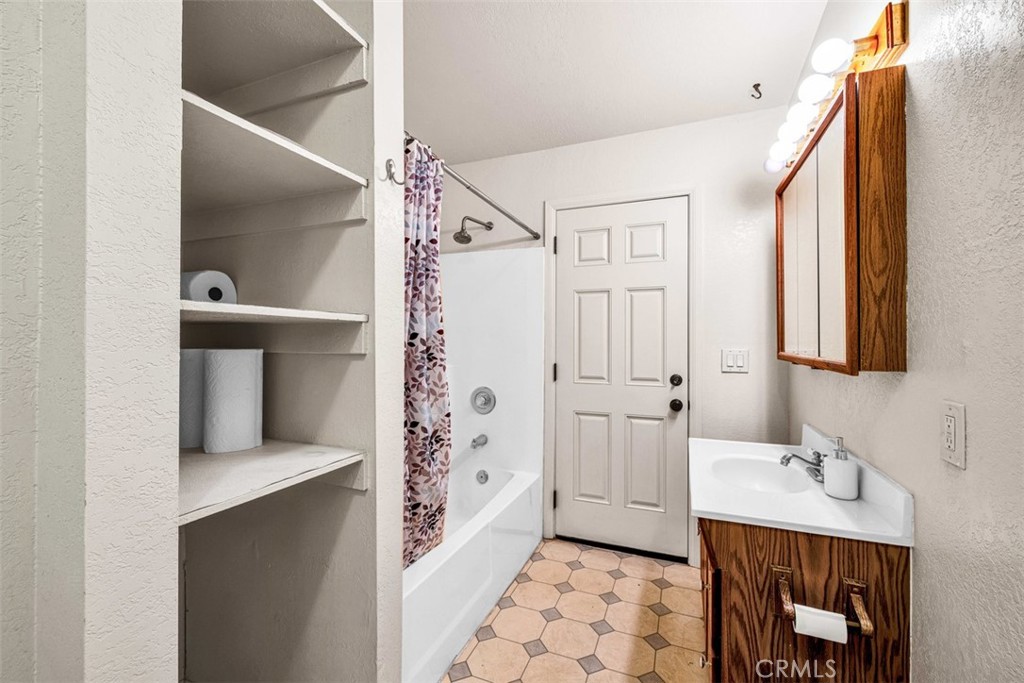 2545 Apache Pass Pioneertown, CA 92268 - Photo 13 of 47 a bathroom with a sink and a mirror