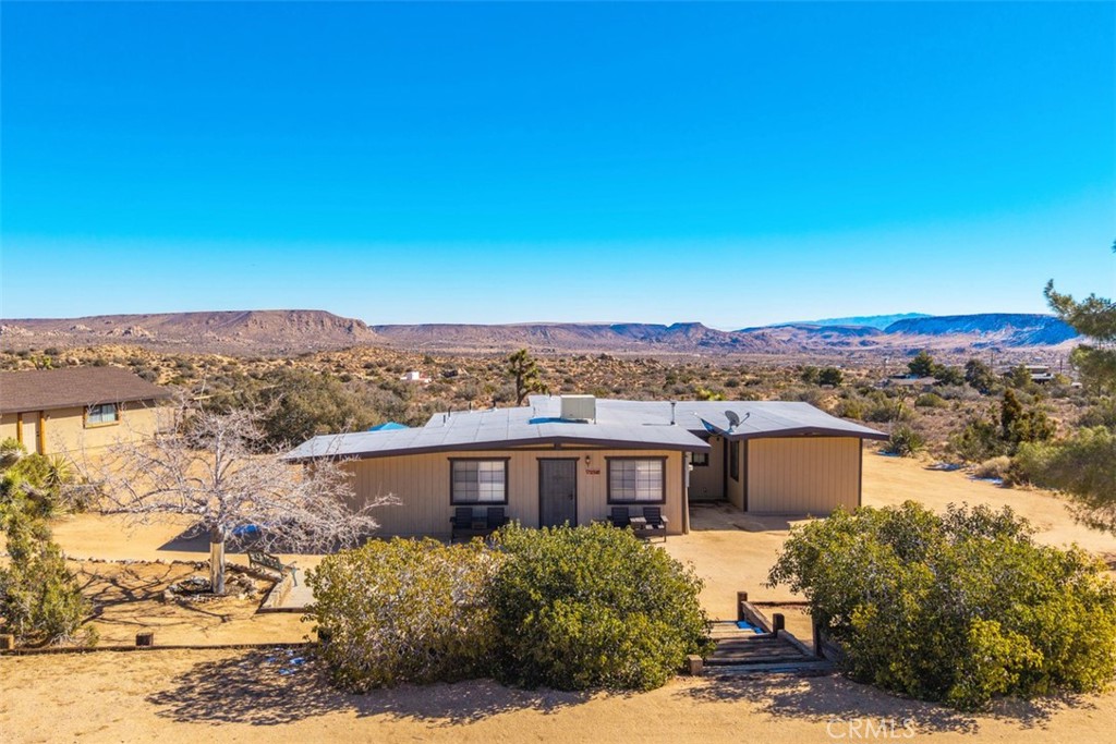 2545 Apache Pass Pioneertown, CA 92268 - Photo 2 of 47 a view of a houses with a yard