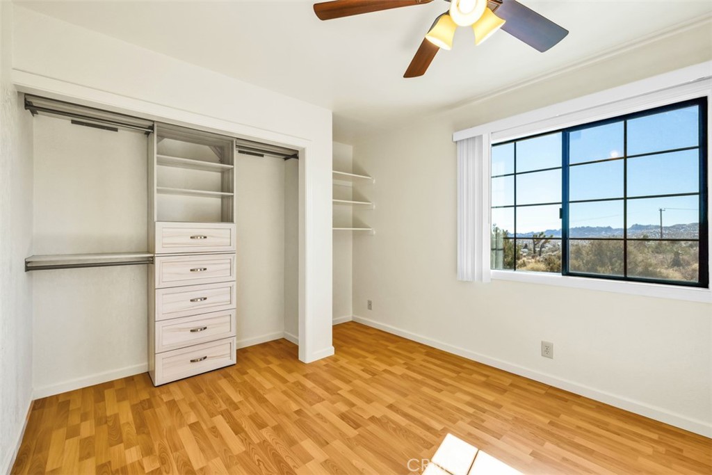 2545 Apache Pass Pioneertown, CA 92268 - Photo 21 of 47 a bedroom with a bed and a window