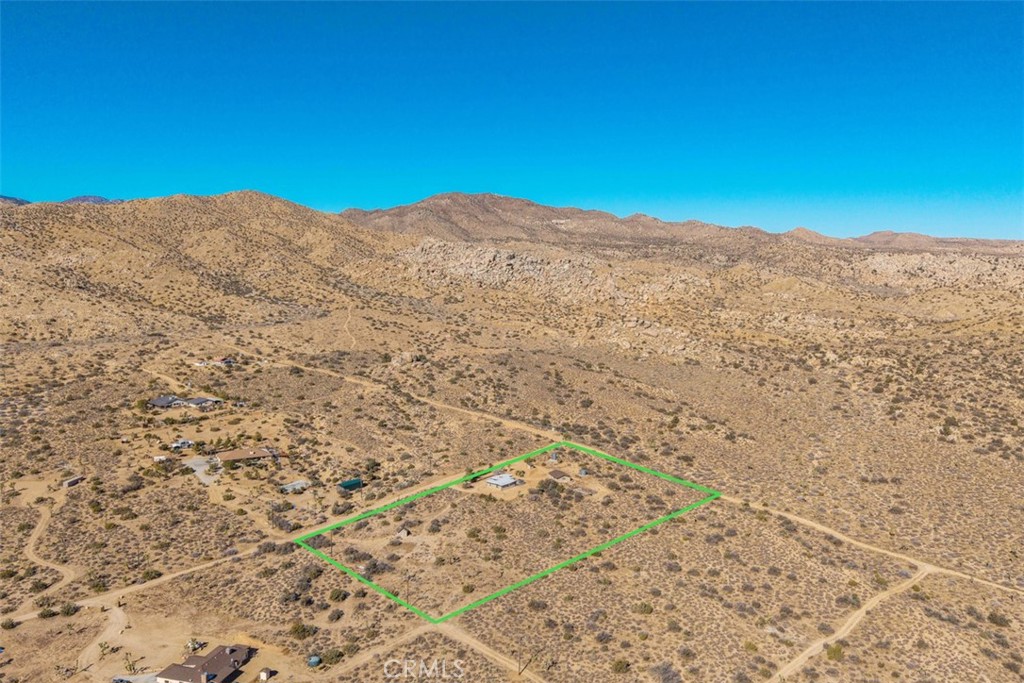 2545 Apache Pass Pioneertown, CA 92268 - Photo 30 of 47 a view of a mountain in the distance in a field