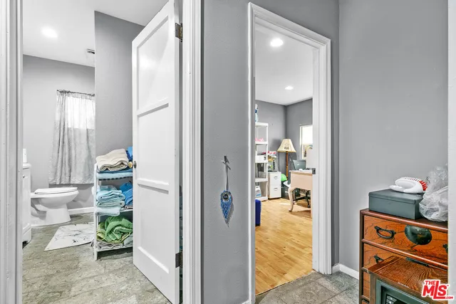 a view of a hallway with seating area