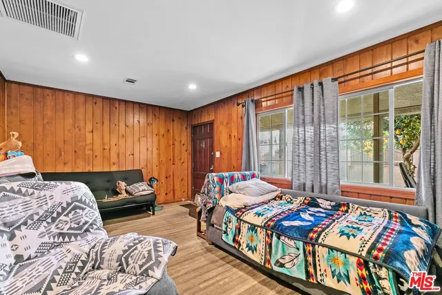 a bedroom with bed and a window