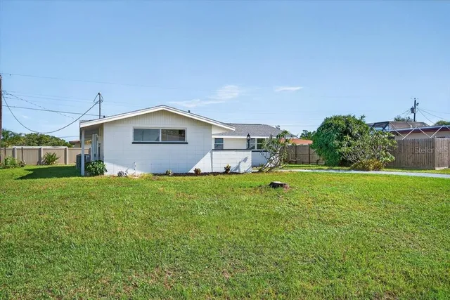 a backyard of a house with lots of green space