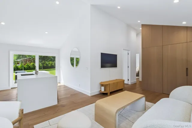 a bedroom with a bed and a television