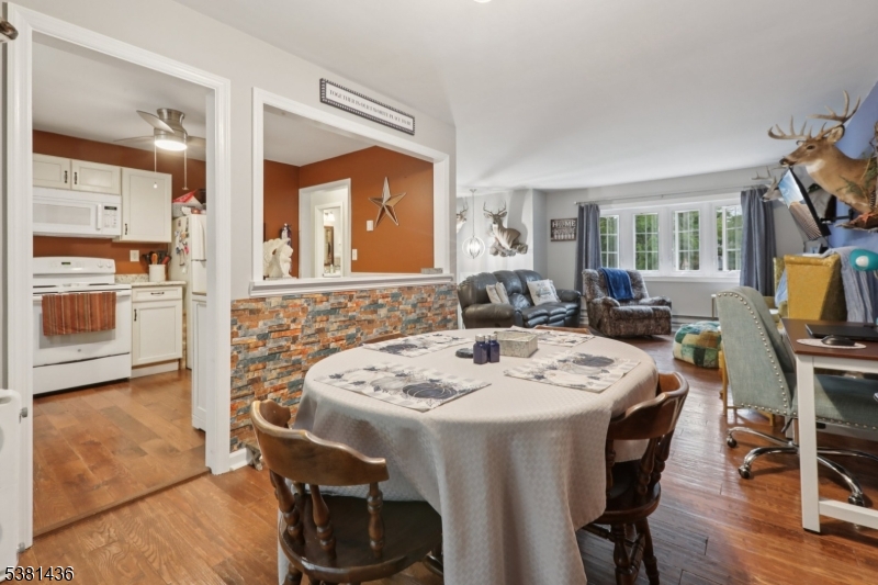 23 Fordham Trail Hopatcong, NJ 07843 - Photo 12 of 31 a view of a dining room with furniture window and wooden floor