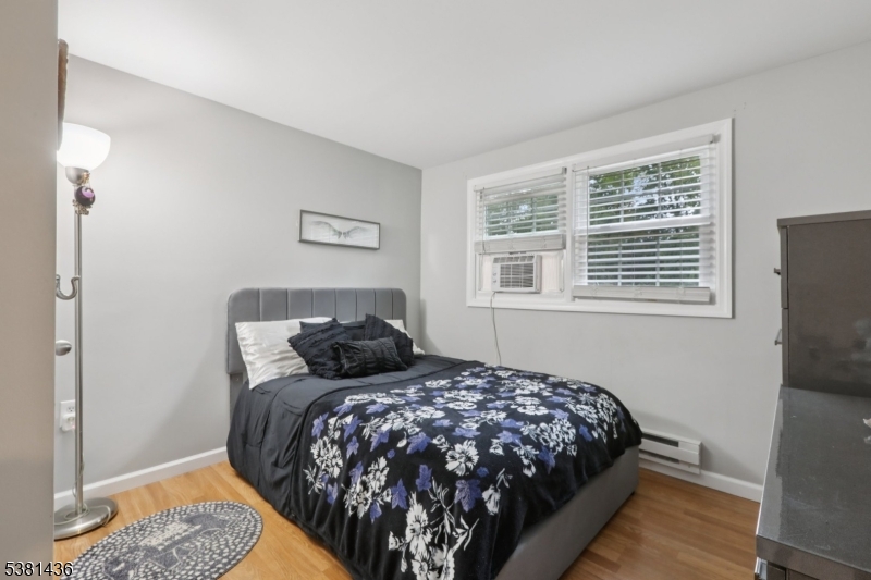 23 Fordham Trail Hopatcong, NJ 07843 - Photo 17 of 31 a bedroom with a bed and wooden floor