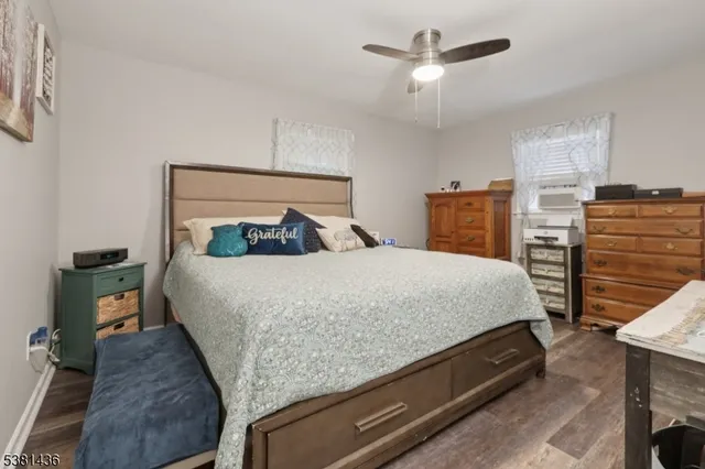 a bedroom with a bed and window