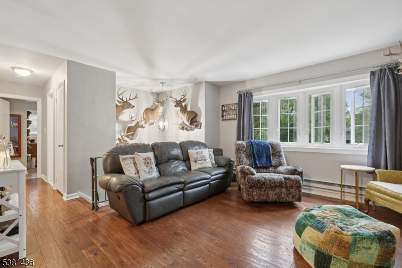 23 Fordham Trail Hopatcong, NJ 07843 - Photo 22 of 31 a living room with furniture and a large window