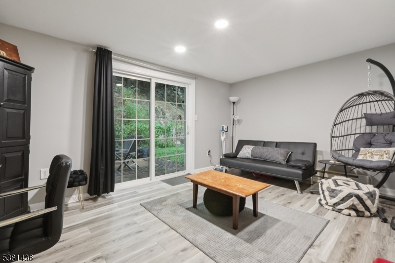 23 Fordham Trail Hopatcong, NJ 07843 - Photo 24 of 31 a living room with furniture a rug and a window