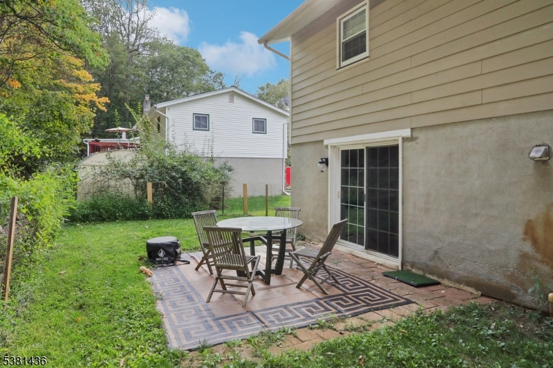 23 Fordham Trail Hopatcong, NJ 07843 - Photo 27 of 31 a view of a patio with table and chairs and potted plants