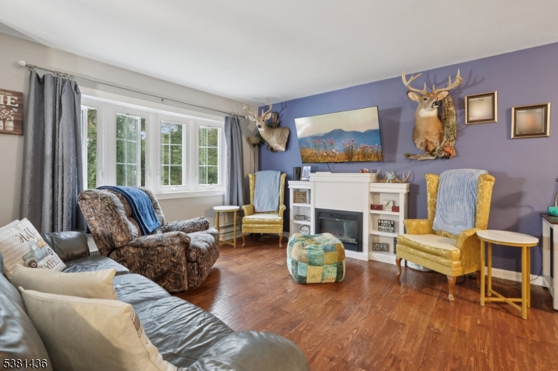 23 Fordham Trail Hopatcong, NJ 07843 - Photo 6 of 31 a living room with furniture and a fireplace