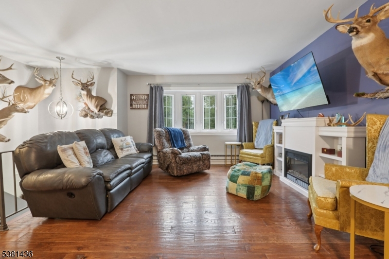 23 Fordham Trail Hopatcong, NJ 07843 - Photo 7 of 31 a living room with furniture fireplace and a large window