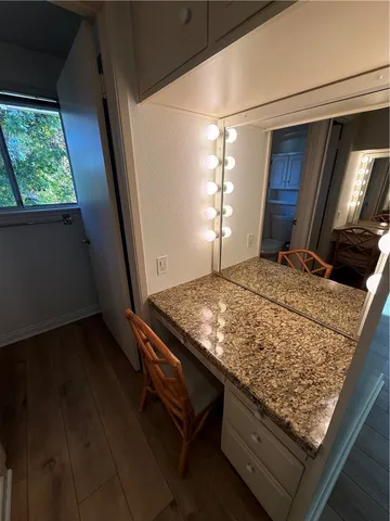 a bed sitting in a room next to a window