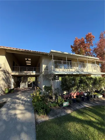 a view of a house with sitting area and furniture