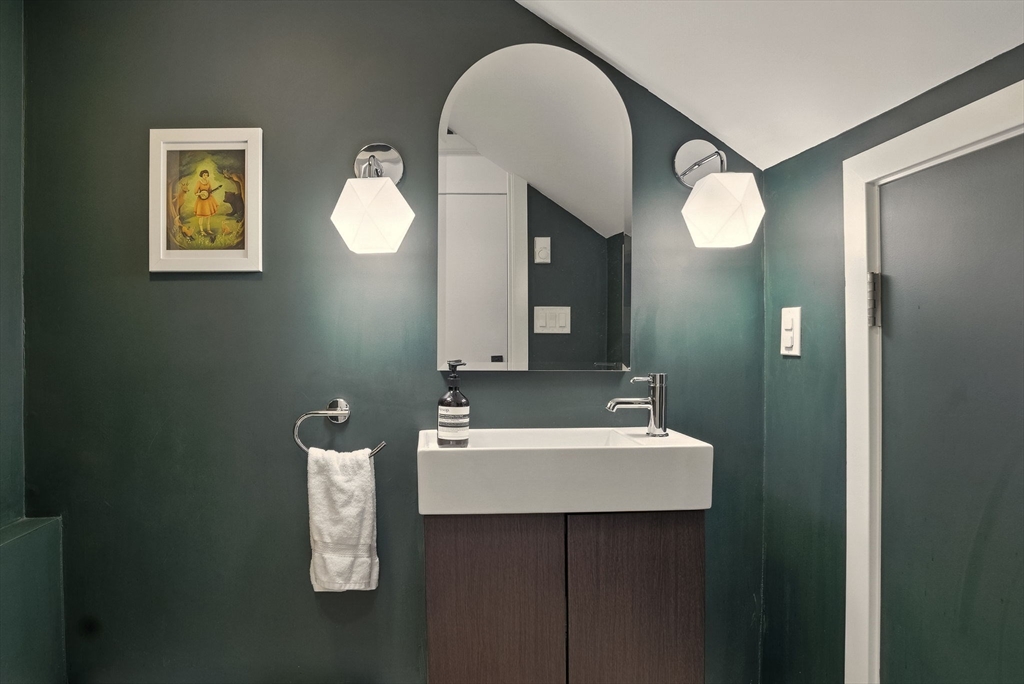 151 Sherman Street Cambridge, MA 02140 - Photo 23 of 35 a bathroom with a sink and a mirror