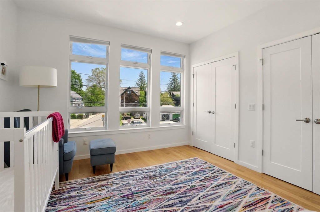 151 Sherman Street Cambridge, MA 02140 - Photo 25 of 35 a view of livingroom with furniture wooden floor and window