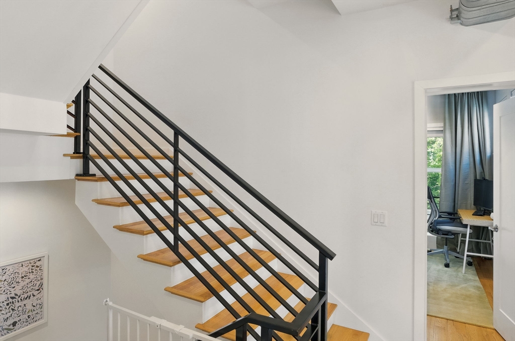 151 Sherman Street Cambridge, MA 02140 - Photo 27 of 35 a view of entryway with wooden floor