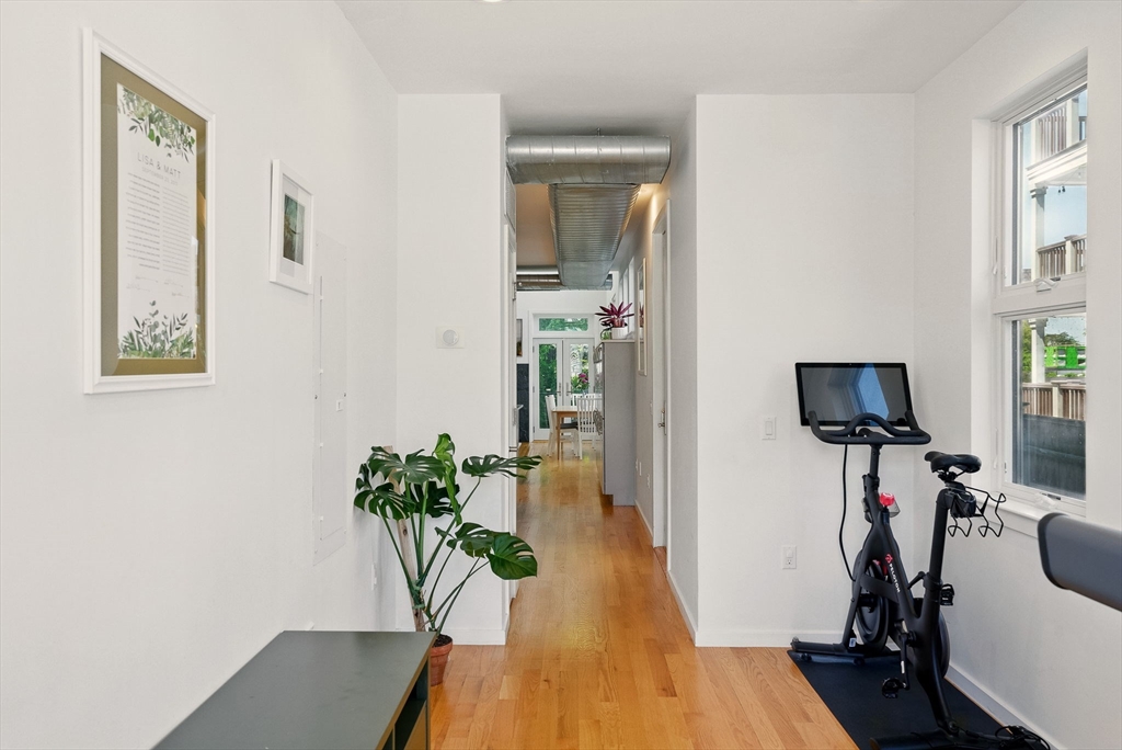 151 Sherman Street Cambridge, MA 02140 - Photo 8 of 35 a view of a workspace with furniture and a potted plant