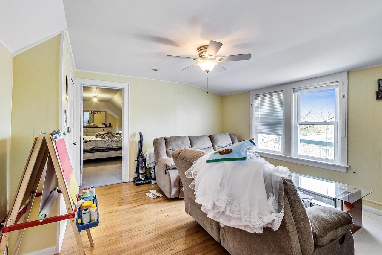 25 Webster Avenue Highwood, IL 60040 - Photo 20 of 25 a living room with furniture a flat screen tv and a large window