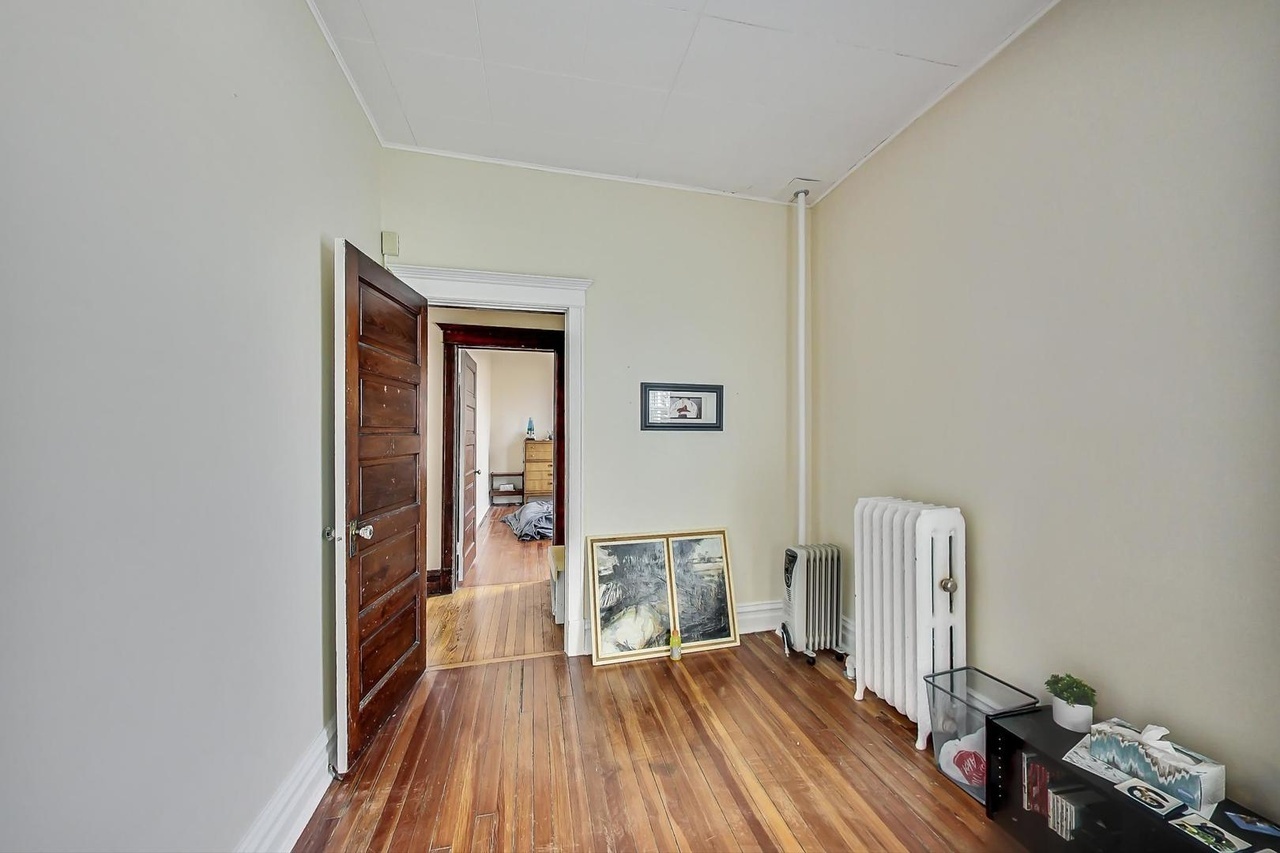25 Webster Avenue Highwood, IL 60040 - Photo 9 of 25 a view of bedroom with a bed and wooden floor