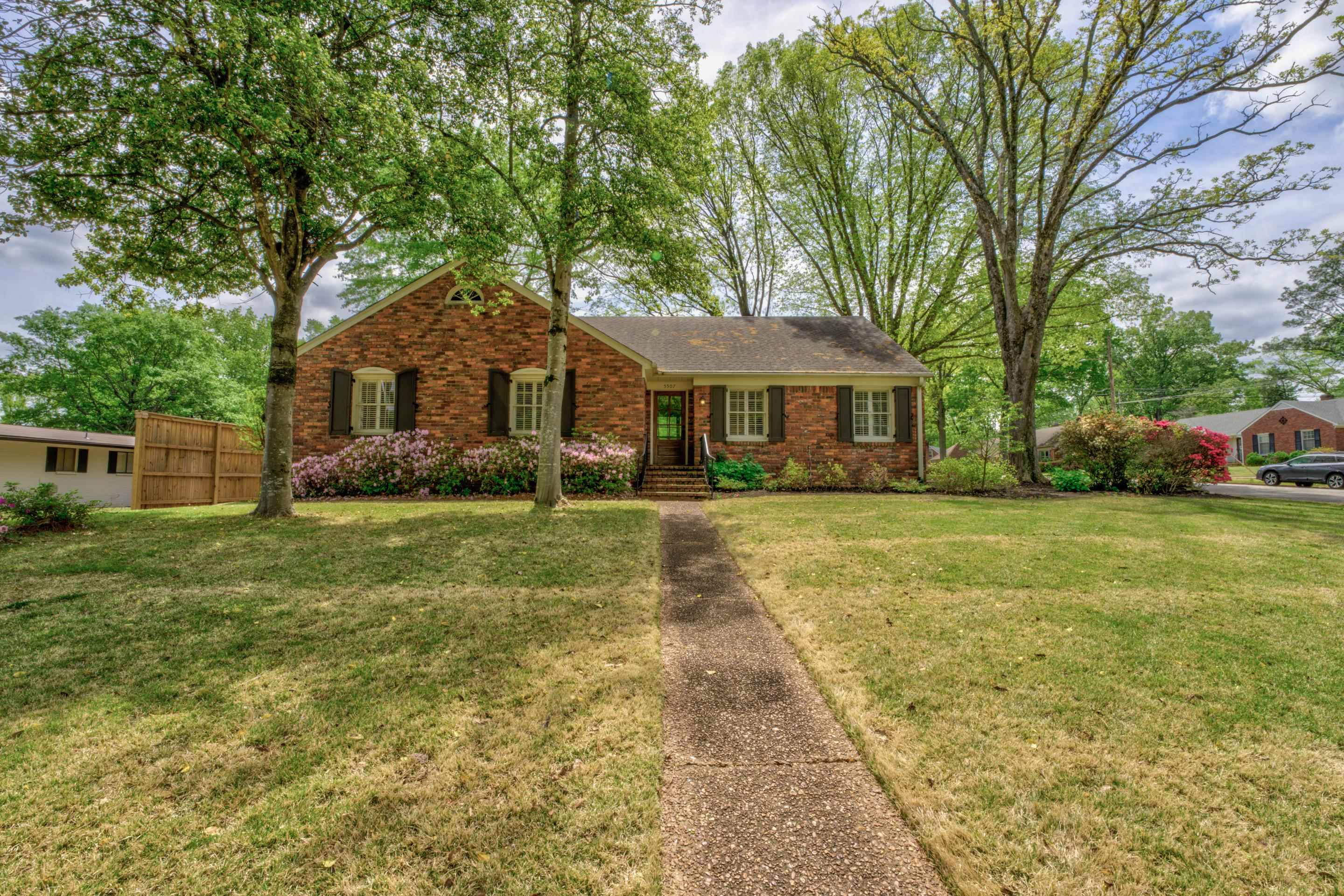 5507 Barfield Road Memphis, TN 38120 - Photo 1 of 31 a front view of a house with garden