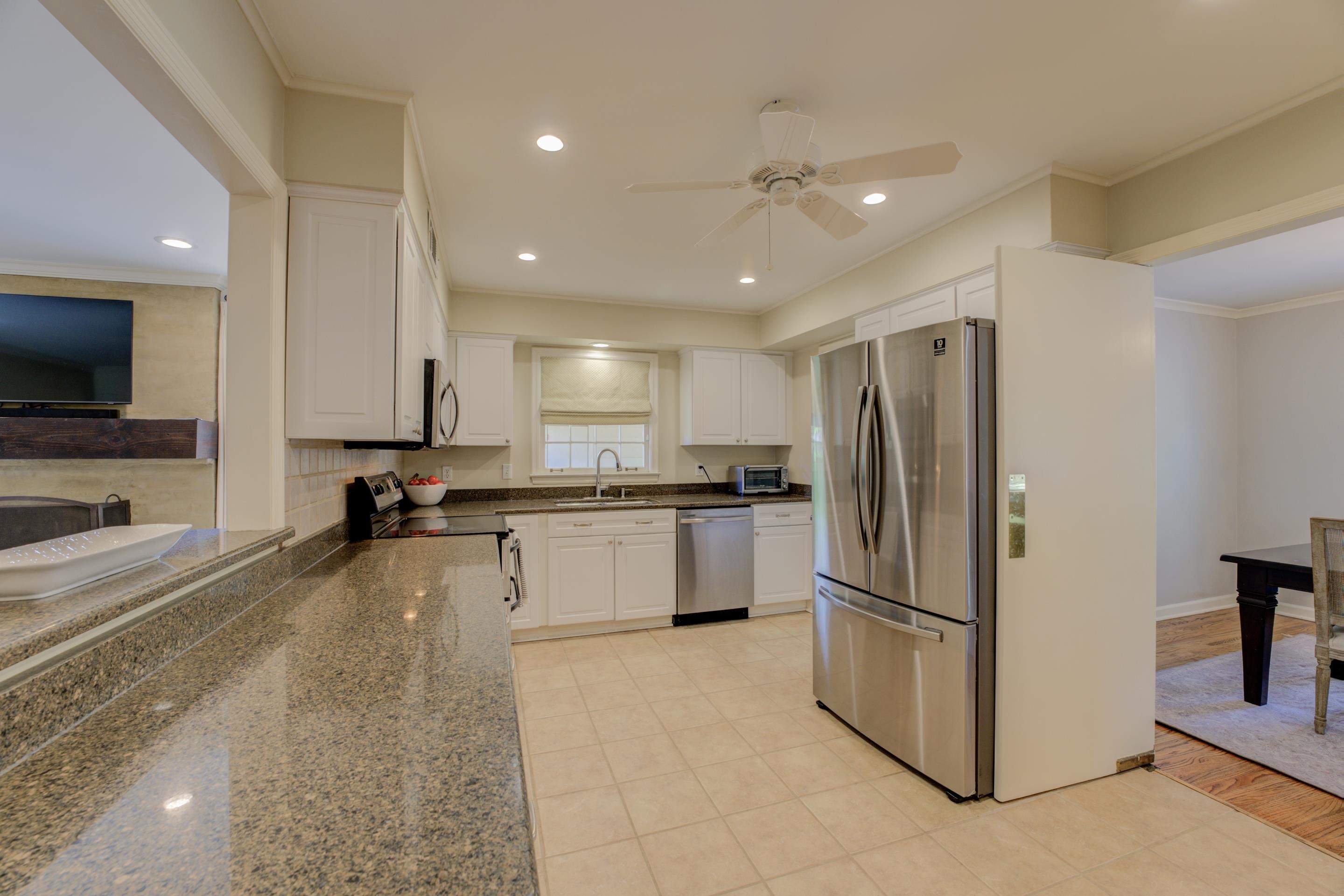 5507 Barfield Road Memphis, TN 38120 - Photo 11 of 31 a kitchen with a refrigerator and a sink