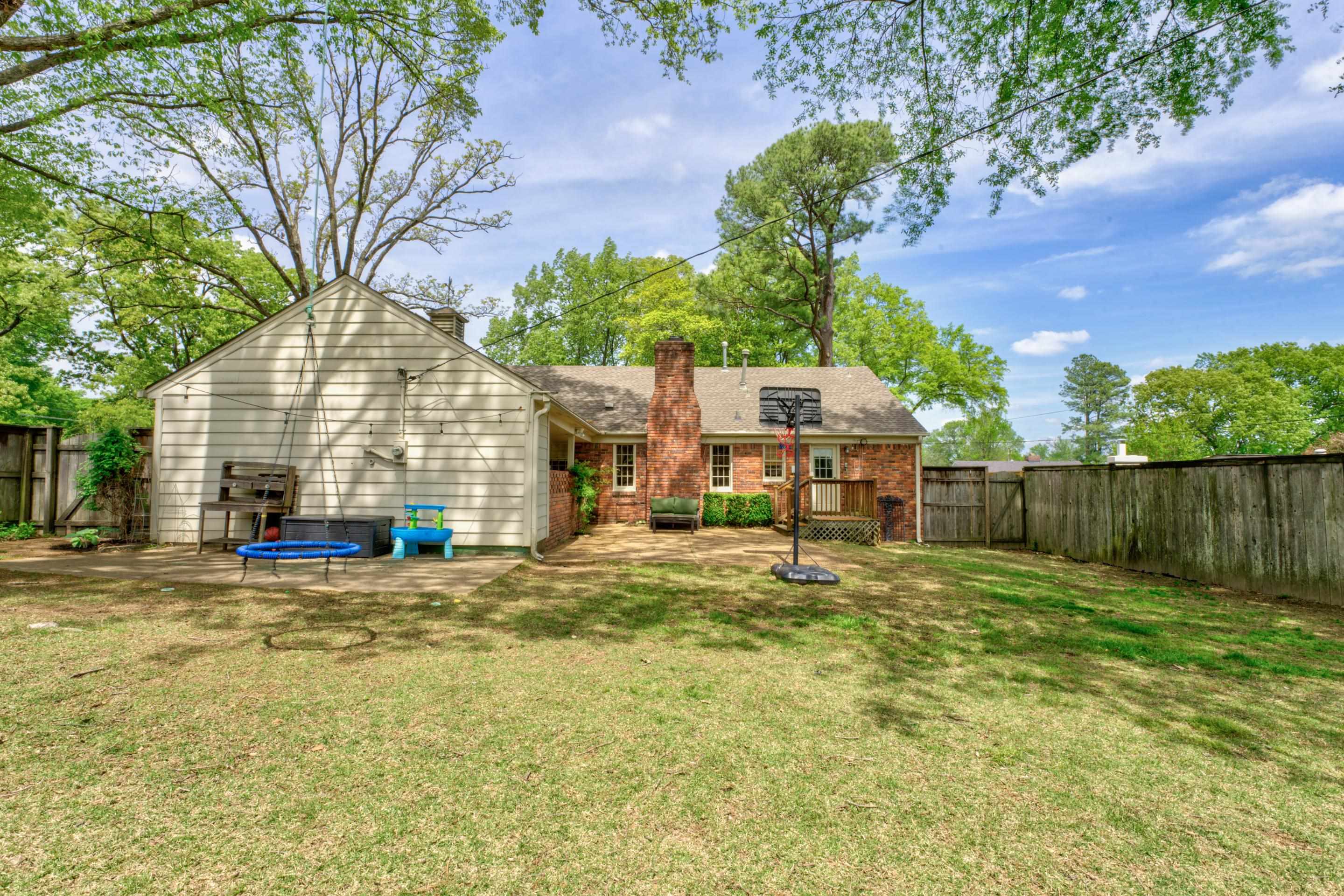 5507 Barfield Road Memphis, TN 38120 - Photo 27 of 31 a view of a house with backyard and sitting area