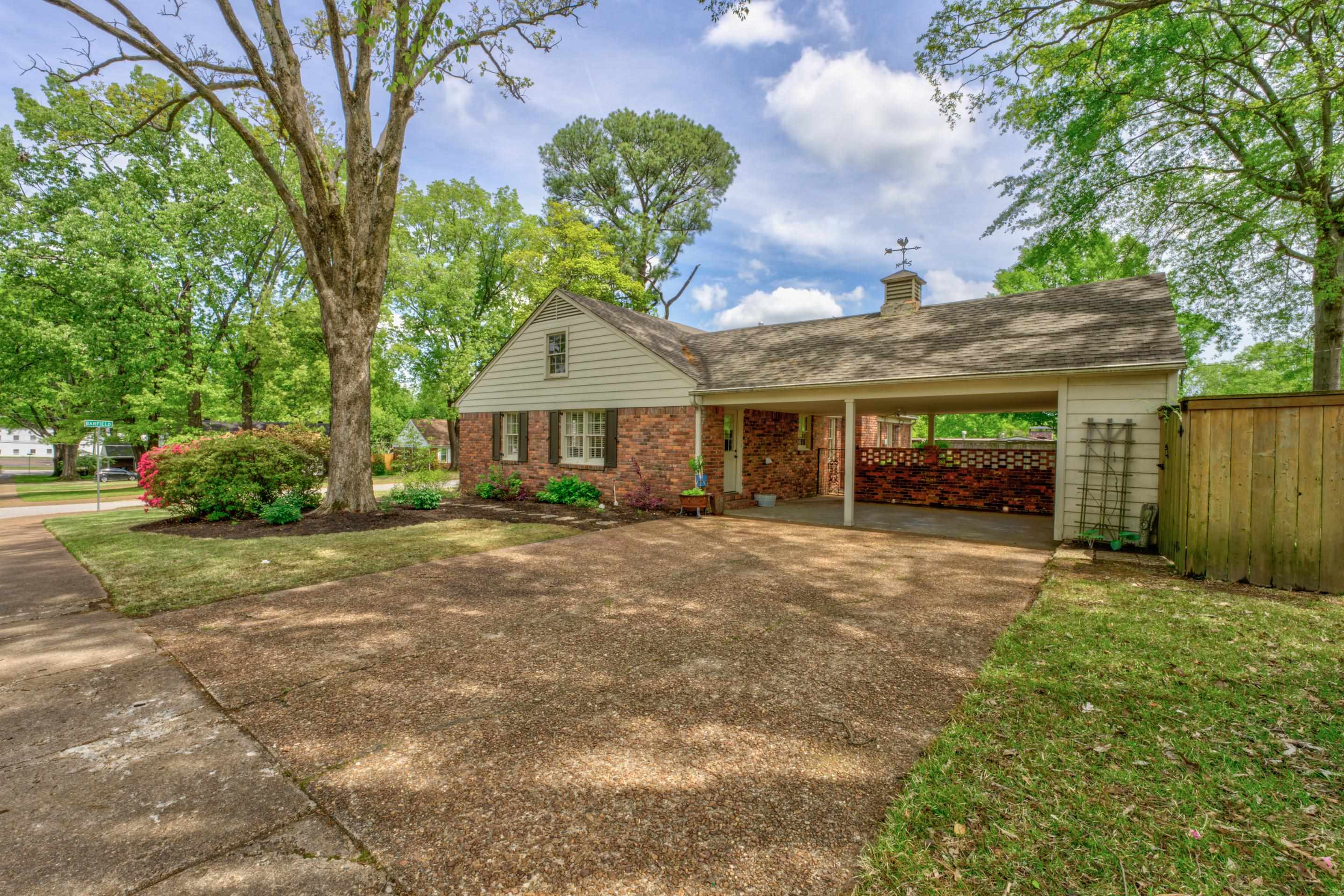 5507 Barfield Road Memphis, TN 38120 - Photo 29 of 31 a front view of a house with garden