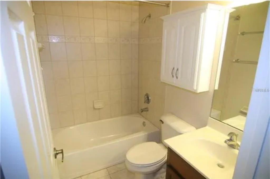 1518 Tally Circle Oviedo, FL 32765 - Photo 13 of 15 a bathroom with a sink a toilet and shower