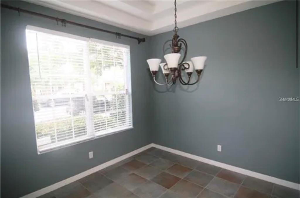1518 Tally Circle Oviedo, FL 32765 - Photo 7 of 15 a view of room with window and chandelier