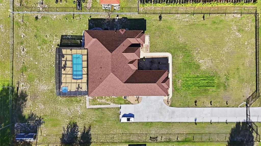 13429 Montevista Road Clermont, FL 34711 - Photo 75 of 89 an aerial view of a house with a yard