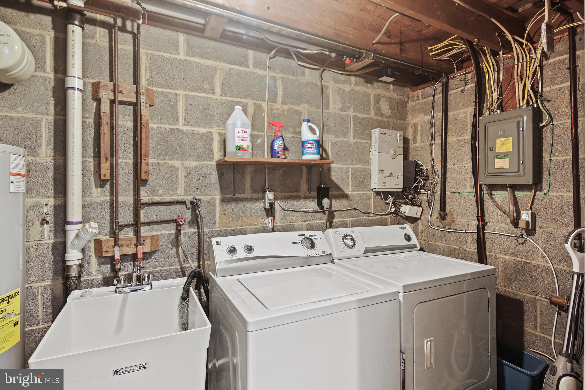 8302 Stillmeadow Road, Unit 1B Nottingham, MD 21236 - Photo 31 of 31 Utility tub & washer/dryer in closet space