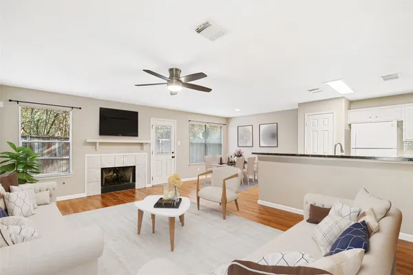 a living room with furniture fireplace and a flat screen tv