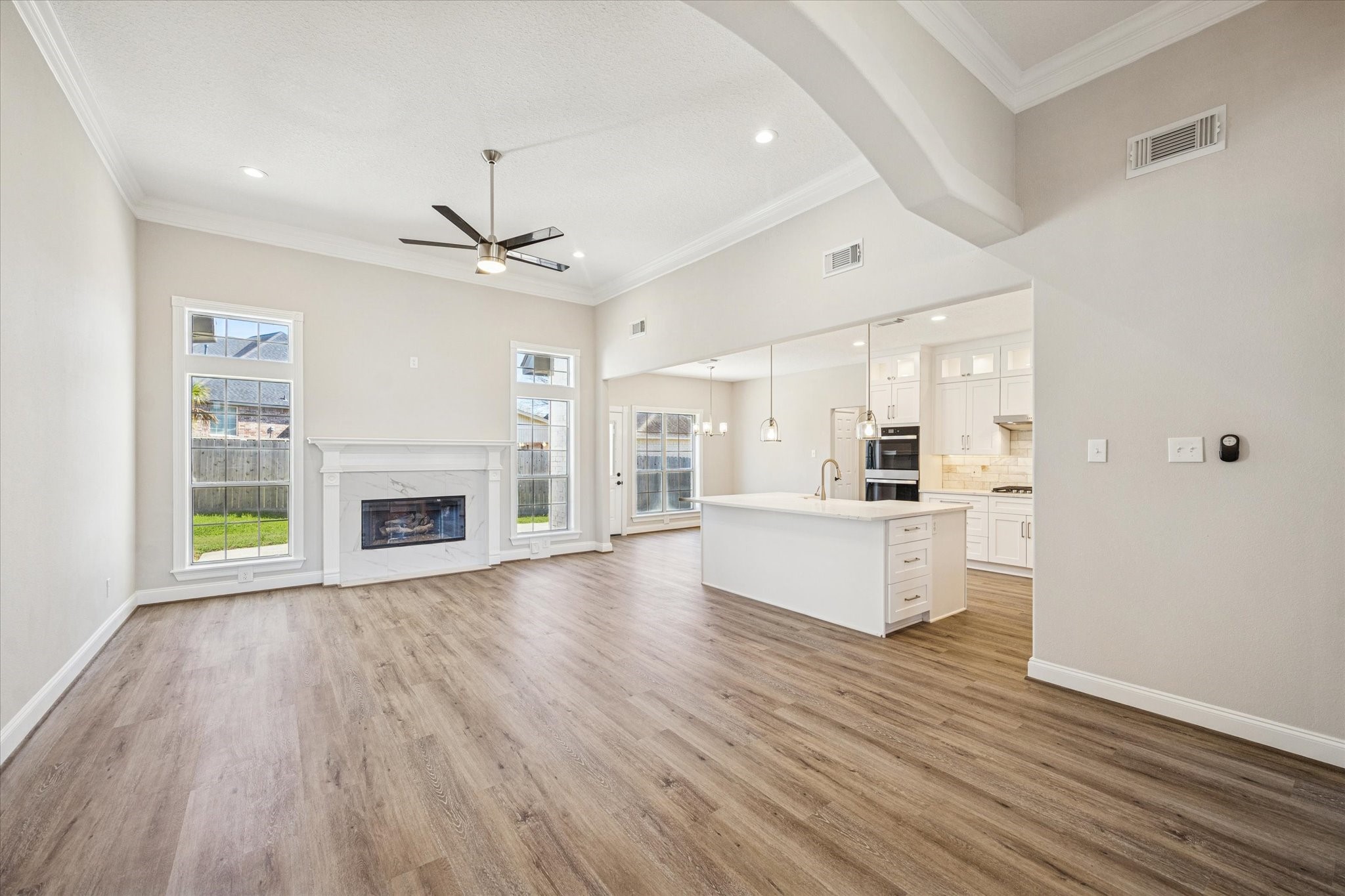 5437 Edgewater Court Willis, TX 77318 - Photo 5 of 29 a view of a kitchen with microwave and furniture