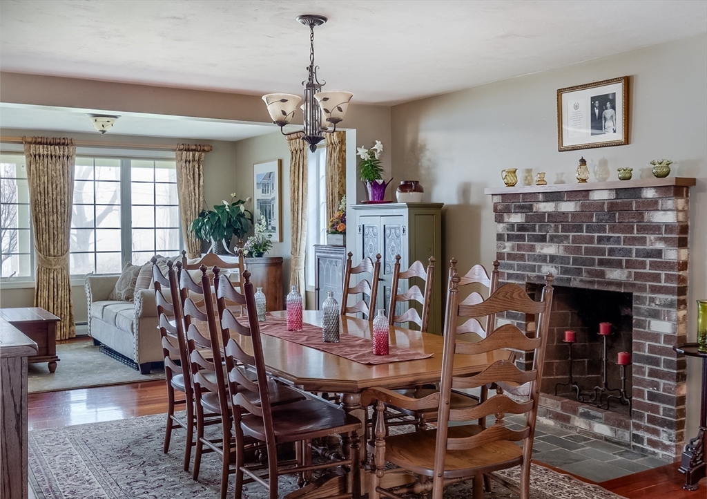 60 Emerald Road Rutland, MA 01543 - Photo 12 of 42 a view of a dining room with furniture window and wooden floor
