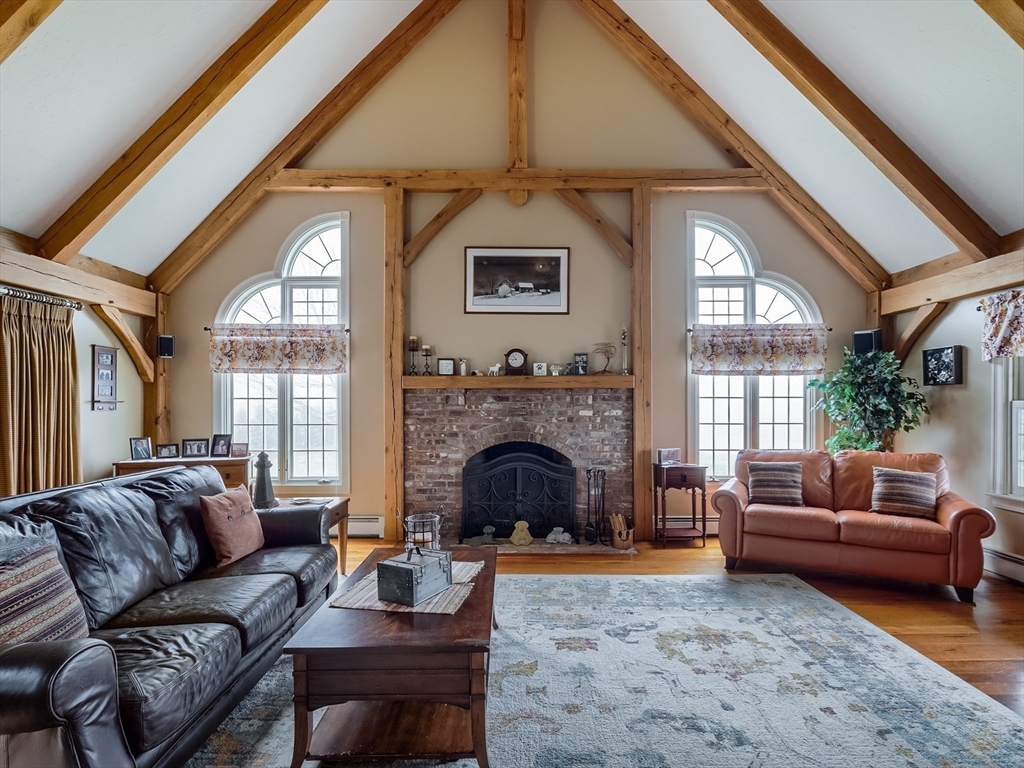 60 Emerald Road Rutland, MA 01543 - Photo 2 of 42 a living room with furniture and a fireplace