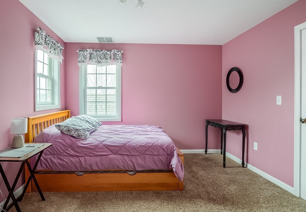 60 Emerald Road Rutland, MA 01543 - Photo 28 of 42 a bedroom with a bed and window