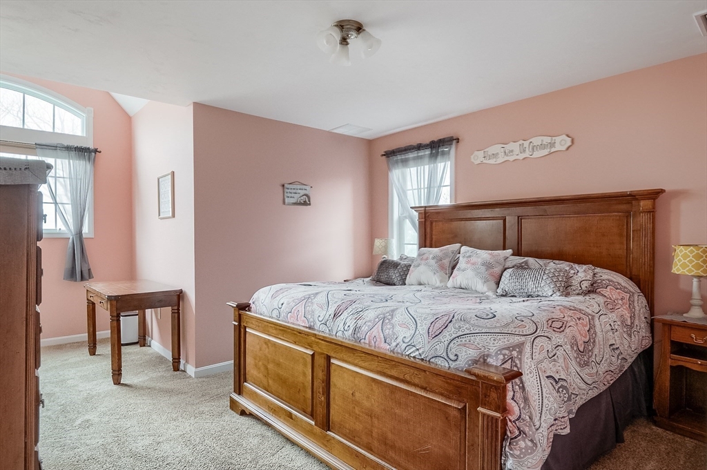 60 Emerald Road Rutland, MA 01543 - Photo 29 of 42 a bedroom with a bed and a cabinets