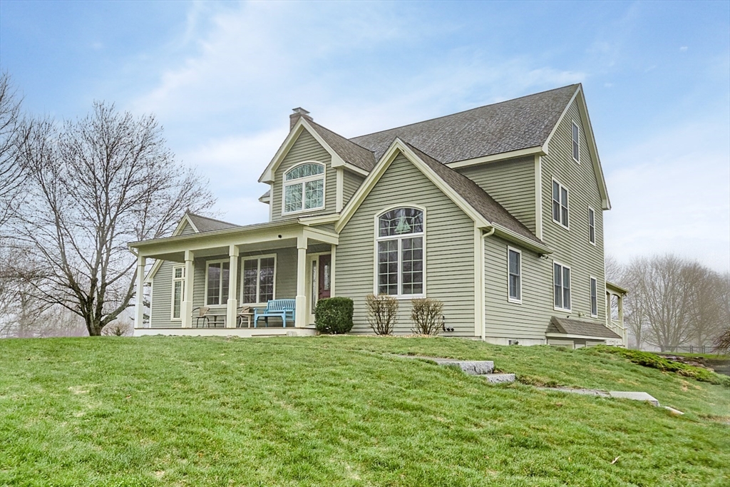 60 Emerald Road Rutland, MA 01543 - Photo 38 of 42 a front view of a house with a garden