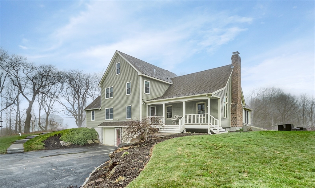 60 Emerald Road Rutland, MA 01543 - Photo 39 of 42 a front view of a house with a yard